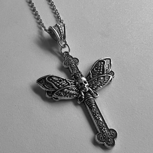 Gothic silver cross necklace with skull and moth wings pendant on metallic chain