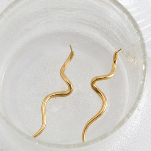 Polished 316 stainless steel wavy curve earrings with golden finish in artistic water