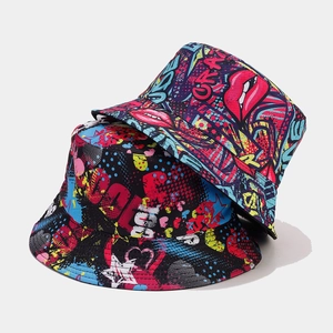 Close-up of reversible bucket hat with pop art graffiti patterns including lips and hearts