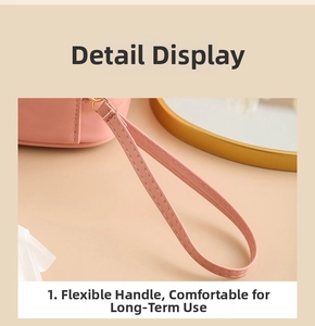 Detail of pink PU leather storage bag featuring a flexible handle and gold metal hook