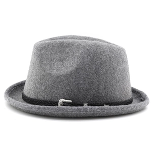 Detail of dark gray felt fedora showing black leather band and ornate silver buckle