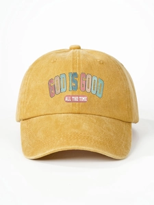 Close-up of vintage washed yellow cotton baseball cap with God Is Good printed text