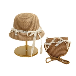 Kids summer straw hat and matching crossbody bag set with white lace bows in tan brown