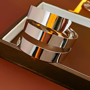 Close-up of polished silver spiral multilayer metal cuff bracelet in a jewelry box