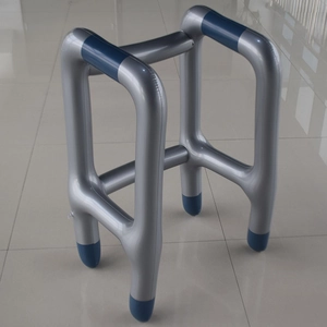 Silver inflatable walker prop with blue handles and four-point base for parties