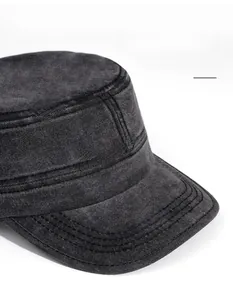 Detail of wide brim on washed cotton military cap with premium stitched texture