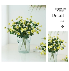 Detail of yellow artificial rose bouquet in light blue glass vase for home decoration
