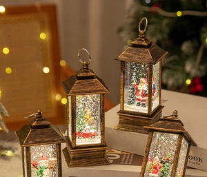 Close-up of vintage bronze Christmas lanterns with Santa and snowman scenes inside