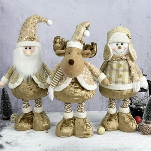 Three large Christmas plush figures including Santa, Elk, and Snowman in champagne gold and beige