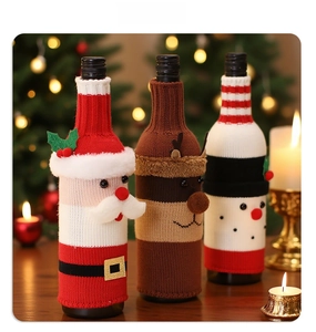 Close-up of knitted Christmas wine bottle covers featuring Santa, reindeer and snowman