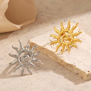 18K gold and silver sunburst rings with spiral center and hammered texture design