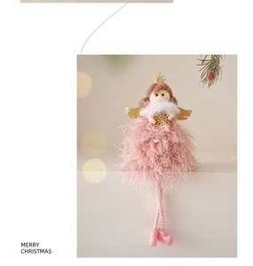 Close-up of pink and gold Christmas angel doll with sequins and long hanging legs