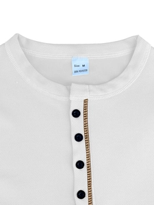 Detail view of the white waffle knit polo collar and button placket for men