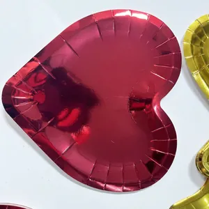 Red heart-shaped disposable paper plates with metallic gold foil for Valentine party
