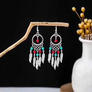 Bohemian dreamcatcher feather earrings with silver plating and turquoise accents