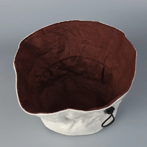 Reversible linen sun hat with wide brim and adjustable drawstring for outdoor use