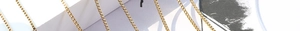 Detailed view of multiple gold-plated stainless steel box chains with a polished finish