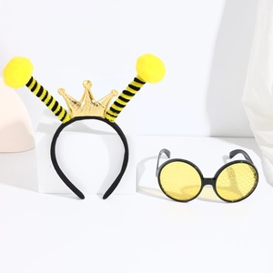 Bee party set detail with striped plush headband, gold crown and yellow honeycomb sunglasses