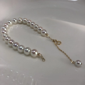 Detail of s925 silver pearl bracelet with 14k gold-filled clasp and adjustable chain