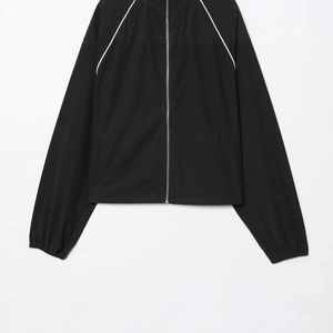 Sporty black nylon puffer jacket with white raglan sleeve piping and high stand collar