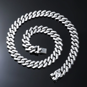 Polished silver Cuban link chain necklace with high-gloss finish on a black background