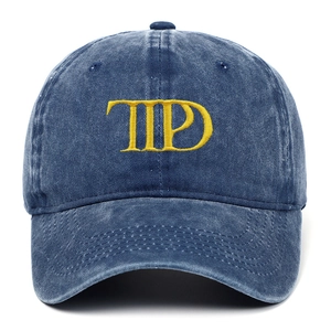 Washed denim baseball cap in indigo with TTPD gold letter embroidery on front