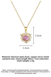 Macro shot of gold-plated hollow heart pendant with pink crystal and white pavé zircons