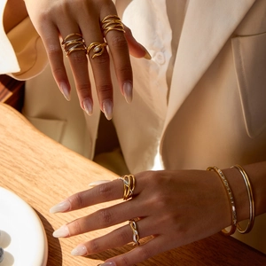 Elegant gold and silver mixed metal layered snake rings and stackable bracelets for women