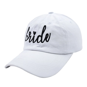 Detail shot of white cotton baseball cap with black bride embroidery and heart symbol