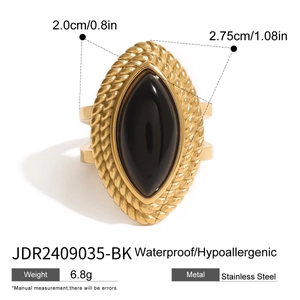 Detail of 18k gold plated stainless steel ring featuring a black marquise onyx stone