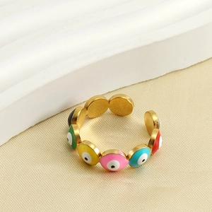 Detailed view of colorful evil eye charms on a gold-plated adjustable stainless steel ring