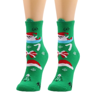 Green Christmas crew socks with Santa Claus and reindeer patterns for women