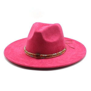 Magenta faux suede wide brim fedora hat with turquoise beaded trim on white background