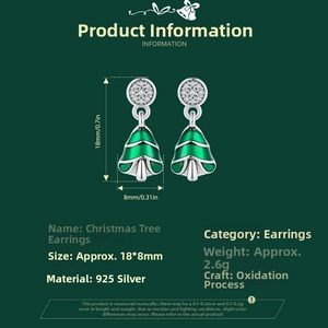 Detailed macro view of 925 sterling silver Christmas tree earrings with green enamel and zircon