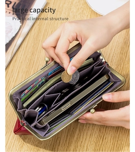 Interior view of red leather clutch wallet showing large capacity and multi-card slots