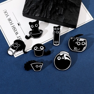 Collection of seven black and white enamel pins featuring funny cartoon cats in liquid poses