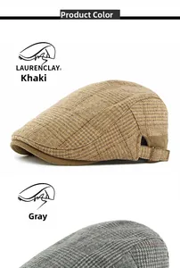 Detail of khaki and grey vintage plaid flat caps with side metal buckles and wool texture