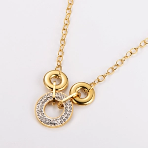 Elegant gold necklace with sparkling crystal encrusted rings and polished metal circles