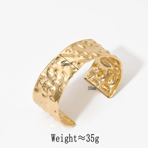 Detail view of 20mm wide gold hammered cuff bracelet with size and weight specifications