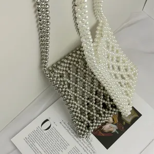 Handmade woven pearl phone bag in silver and cream featuring a hollow diamond pattern