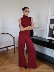 Women's burgundy turtleneck sleeveless knit top and wide-leg pants two-piece set