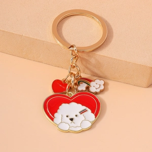Detailed view of heart-shaped keychain featuring cartoon dog pendant and rainbow cloud charm