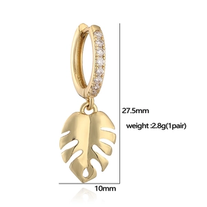 Macro view of gold Monstera leaf earring with cubic zirconia and size dimensions