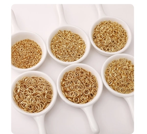 Golden stainless steel jump rings in various sizes for DIY jewelry making and assembly