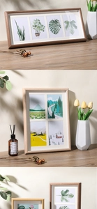 Detail of multi-aperture wooden photo frames in natural wood and dark brown finishes