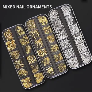 12-grid nail art kit with gold and silver stars, moons, and rivets in a clear box