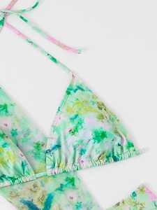 Detail view of abstract floral bikini top with triangle cups and halter neck ties