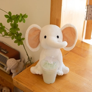 Cute white plush elephant doll with pink ears in sitting position for baby soothing