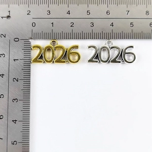 Detailed scale measurement showing 2026 year pendants in gold and silver finish