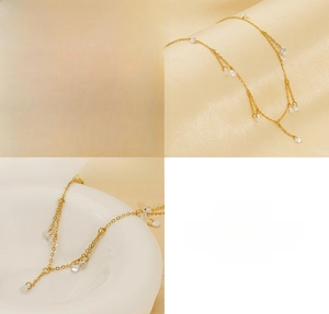Close-up detail of gold stainless steel necklace with sparkling zircon tassel charms